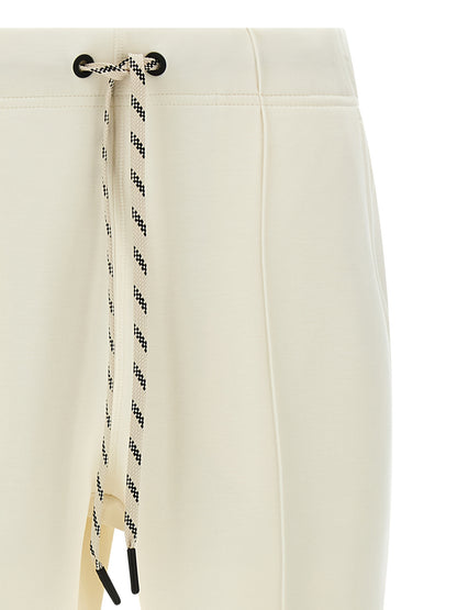 Joggers by Moncler Grenoble for women in stretch viscose polyester white & print presents a tailored silhouette, showcasing a tailored and long cut with a refined for a truly tailored aesthetic.