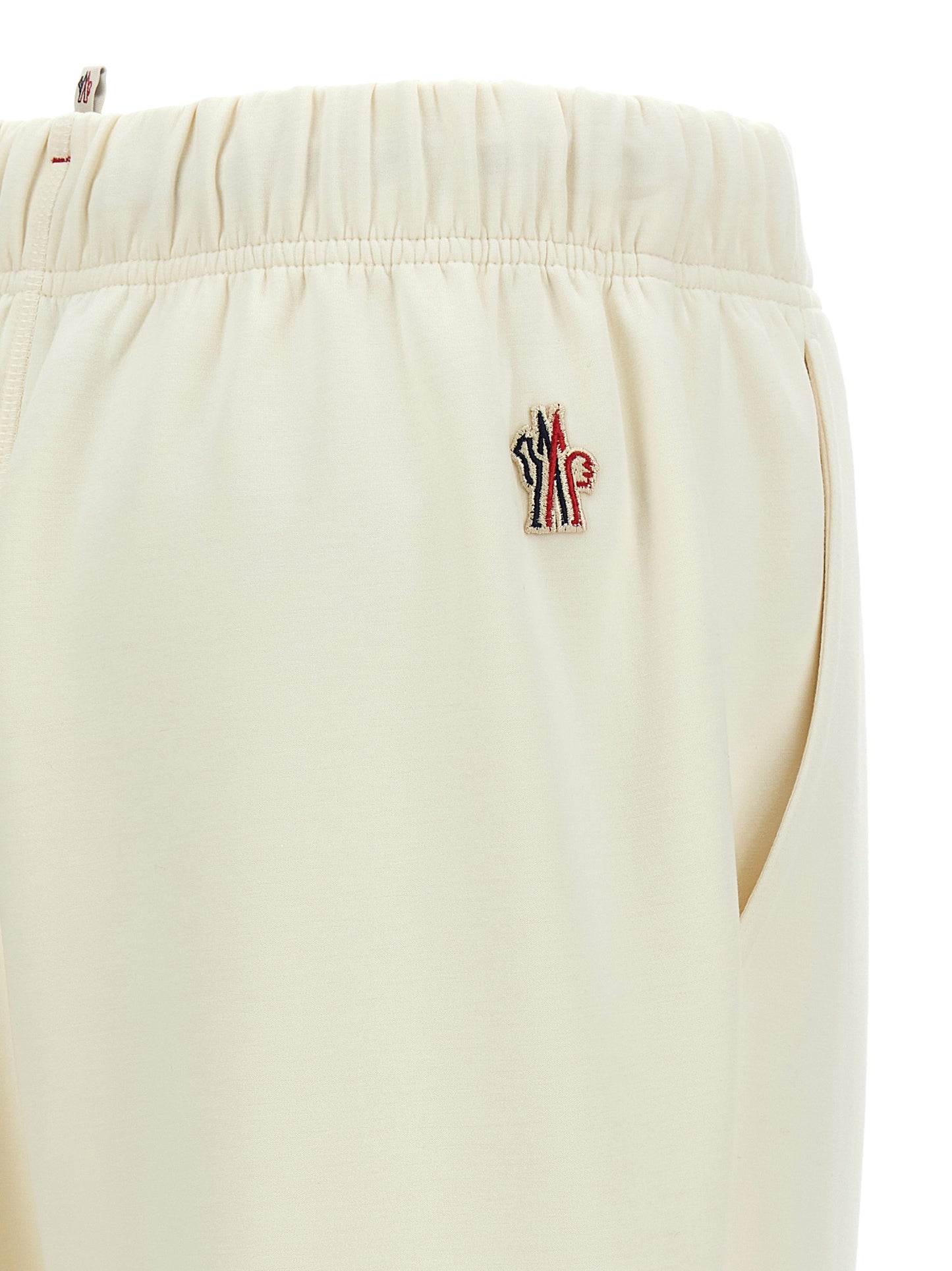 Joggers by Moncler Grenoble for women in stretch viscose polyester white & print features a polished silhouette with a polished , reaching a polished long and finished with a polished .