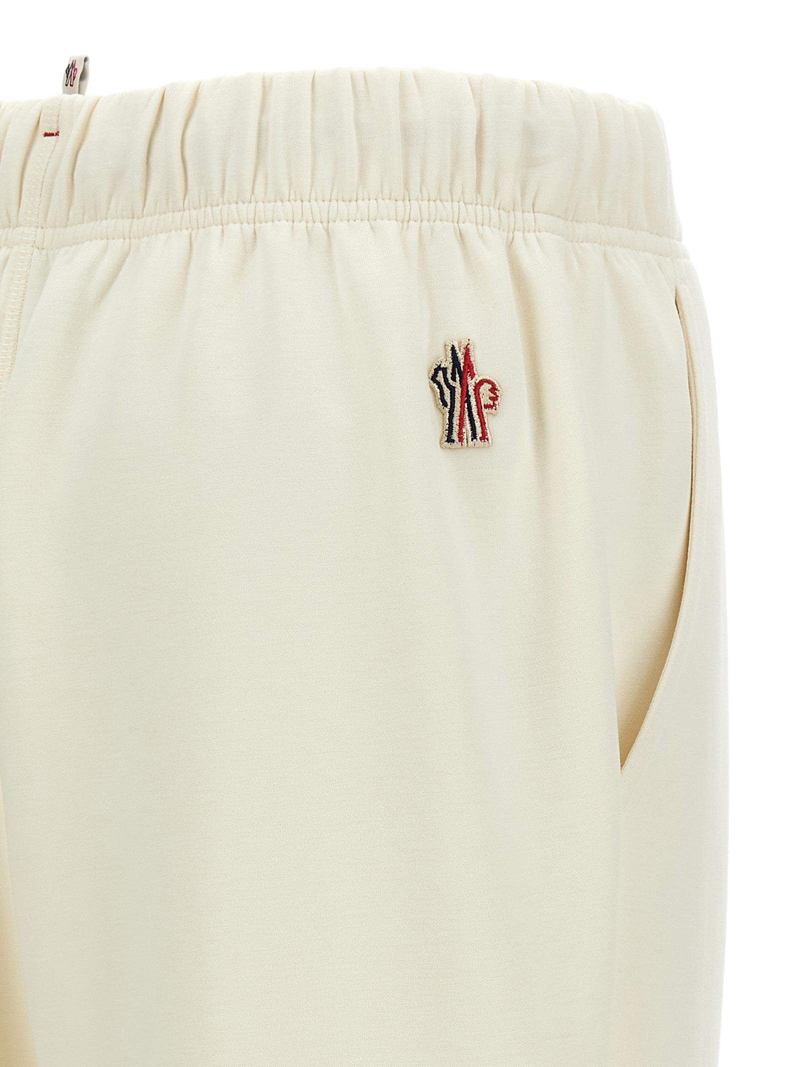 Joggers by Moncler Grenoble for women in stretch viscose polyester white & print features a polished silhouette with a polished , reaching a polished long and finished with a polished .