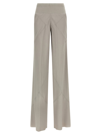 Trousers by Rick Owens for women in silk & acetate gray presents a perennial silhouette, meticulously tailored with a flared & wide cut, long finish, and an elegant .