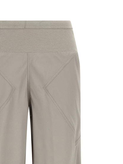 Trousers by Rick Owens for women in silk & acetate gray features a tailored silhouette with a tailored flared & wide, defined by its long and a sophisticated .