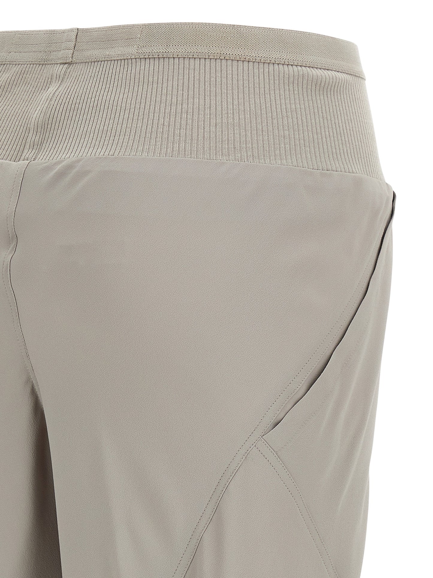 Trousers by Rick Owens for women in silk & acetate gray presents a perennial silhouette, meticulously tailored with a flared & wide cut, long finish, and an elegant .