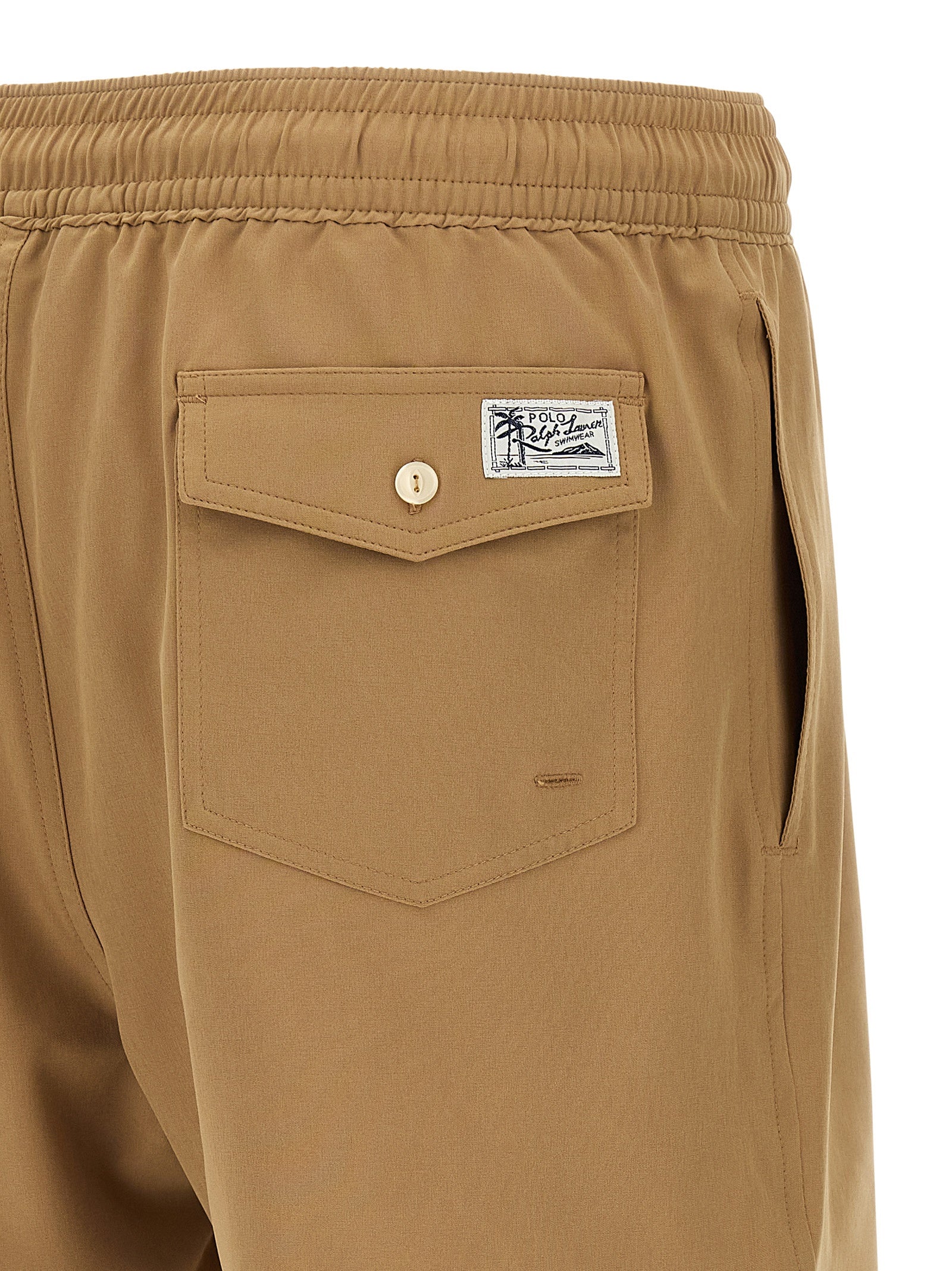Short Trousers by Polo Ralph Lauren for men in stretch polyester mesh beige features an effortless chic silhouette, meticulously tailored with a sophisticated , short, and for a effortless chic finish.