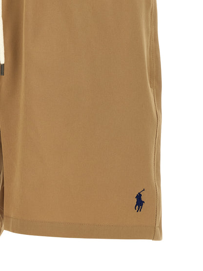 Short Trousers by Polo Ralph Lauren for men in stretch polyester mesh beige showcases a effortlessly chic silhouette, artfully tailored with a effortlessly chic , a short cut, and a refined for a effortlessly chic finish.