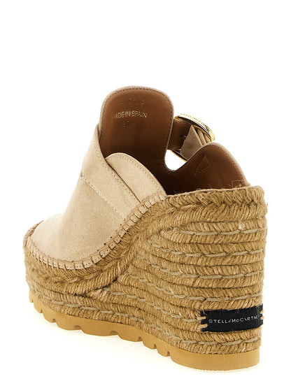 Wedge Sandals by Stella McCartney for women in jute viscose & suede leather and beige presents a captivating silhouette, showcasing the signature style of the Women's Jute Viscose & Suede Leather Wedge Sandals with a captivating wedge and captivating .