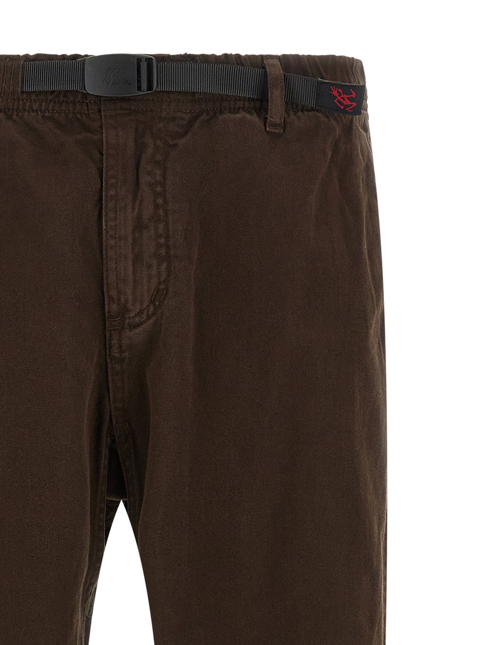 Trousers by Gramicci for men in organic cotton twill brown features an on trend silhouette, showcasing a sophisticated wide with a long and for an on trend finish.