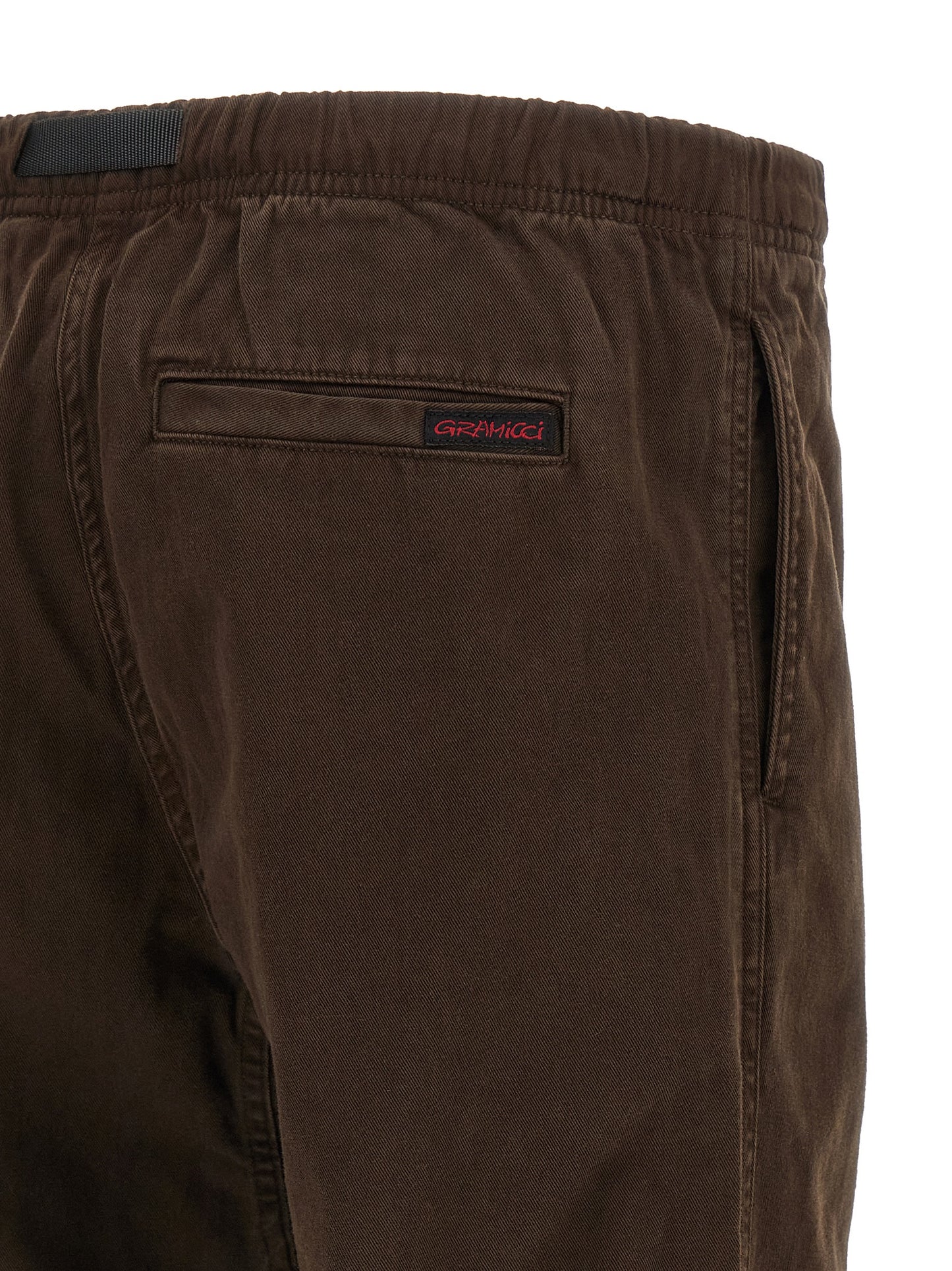 Trousers by Gramicci for men in organic cotton twill brown presents a perennial silhouette, meticulously tailored with a wide cut, long finish, and an elegant .