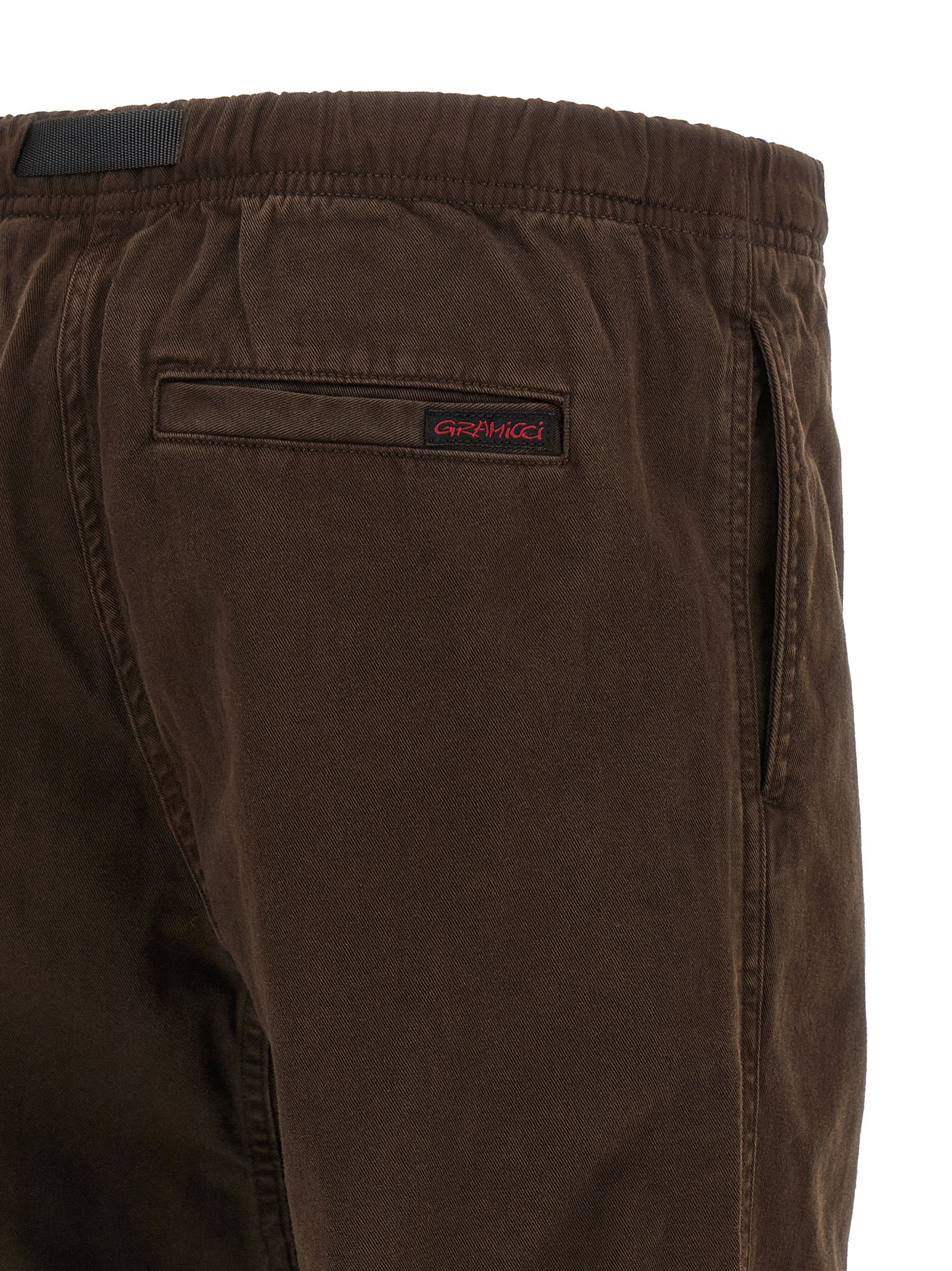 Trousers by Gramicci for men in organic cotton twill brown presents a perennial silhouette, meticulously tailored with a wide cut, long finish, and an elegant .