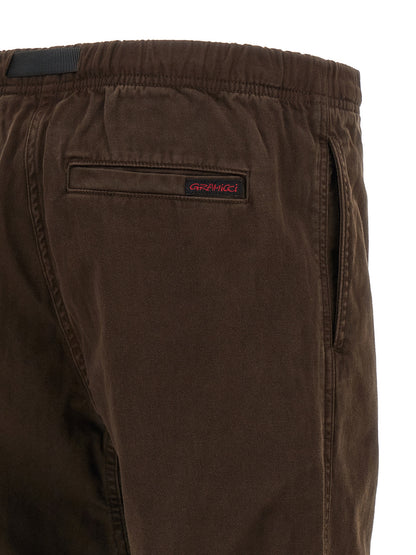 Trousers by Gramicci for men in organic cotton twill brown presents a perennial silhouette, meticulously tailored with a wide cut, long finish, and an elegant .