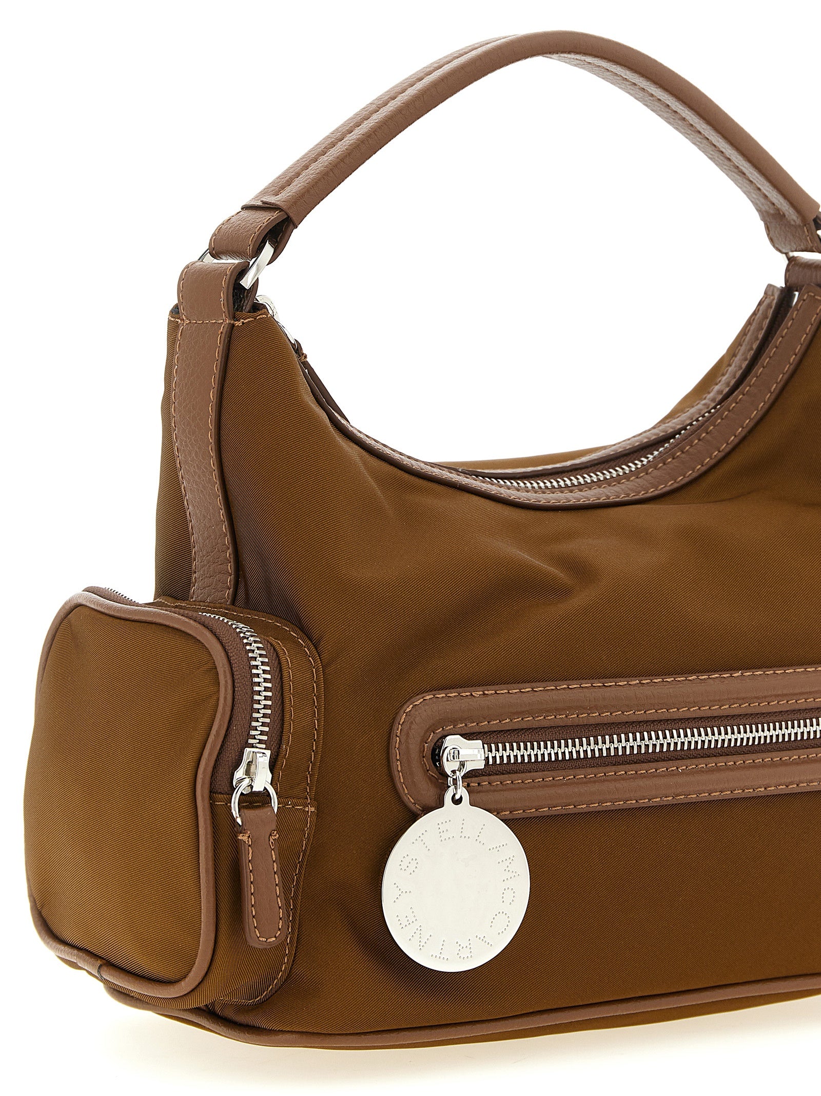 Crossbody Handbag by Stella McCartney for women in nylon brown features a transformative sophistication silhouette, showcasing a secure , ample , and versatile crossbody-strap & adjustable-strap for a transformative sophistication look.