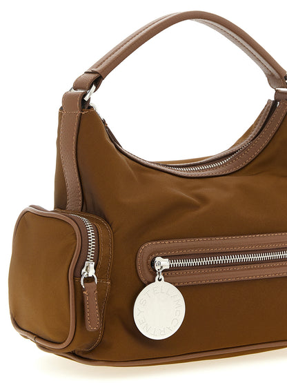 Crossbody Handbag by Stella McCartney for women in nylon brown features a transformative sophistication silhouette, showcasing a secure , ample , and versatile crossbody-strap & adjustable-strap for a transformative sophistication look.