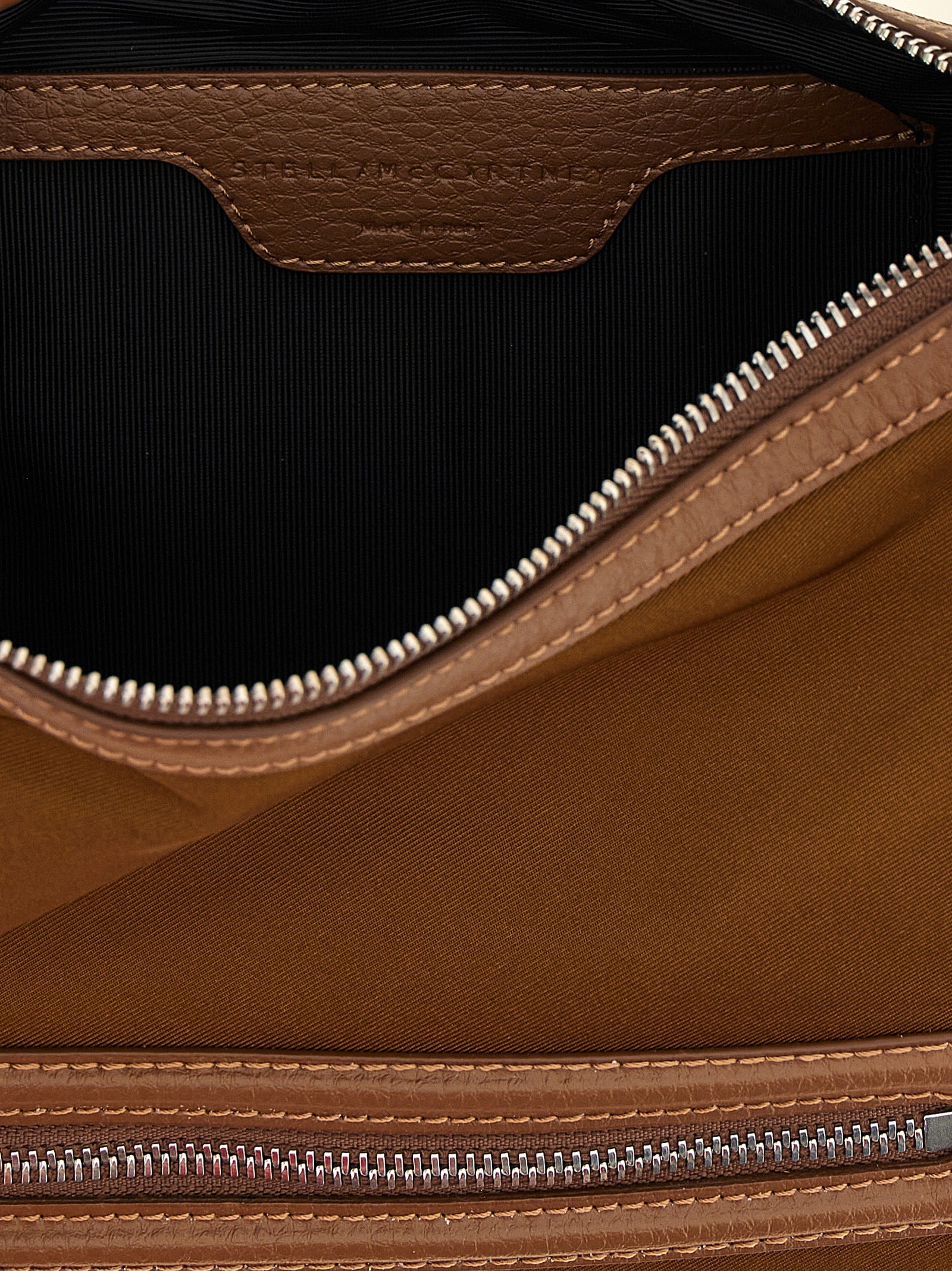 Crossbody Handbag by Stella McCartney for women in nylon brown features a versatile chic silhouette, meticulously detailed with a secure , ample , and versatile crossbody-strap & adjustable-strap.