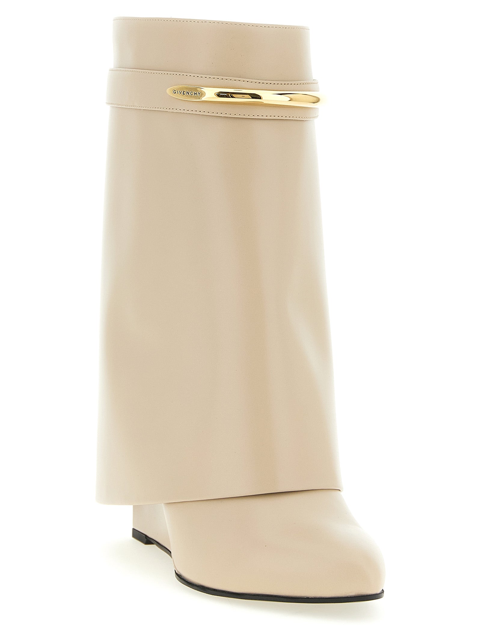 Wedge Ankle Boots by Givenchy for women in calfskin leather beige features an high-performance silhouette, showcasing the sophisticated design of the Women's Calfskin Leather Wedge Ankle Boots with a wedge and a refined pointed toe style.