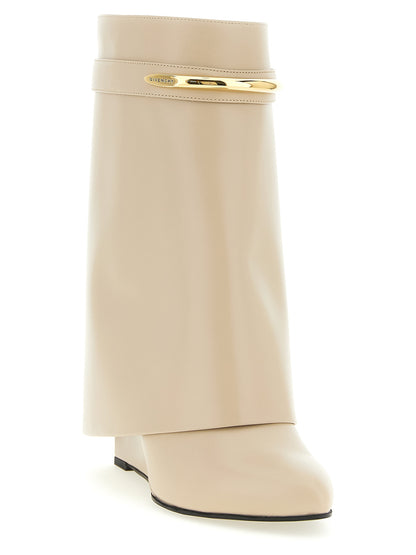 Wedge Ankle Boots by Givenchy for women in calfskin leather beige features an high-performance silhouette, showcasing the sophisticated design of the Women's Calfskin Leather Wedge Ankle Boots with a wedge and a refined pointed toe style.