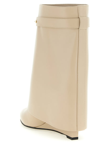 Wedge Ankle Boots by Givenchy for women in calfskin leather beige showcases a impeccable silhouette as Women's Calfskin Leather Wedge Ankle Boots, artfully defined by a impeccable wedge and a impeccable pointed toe style.