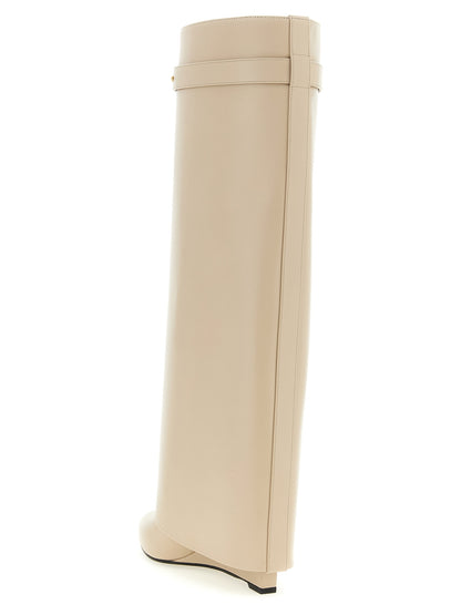 Wedge Over-The-Knee Boots by Givenchy for women in calfskin leather beige features an avant-garde Grace Women's Calfskin Leather Wedge Over-The-Knee Boots silhouette, defined by a sophisticated wedge and a avant-garde pointed toe style.