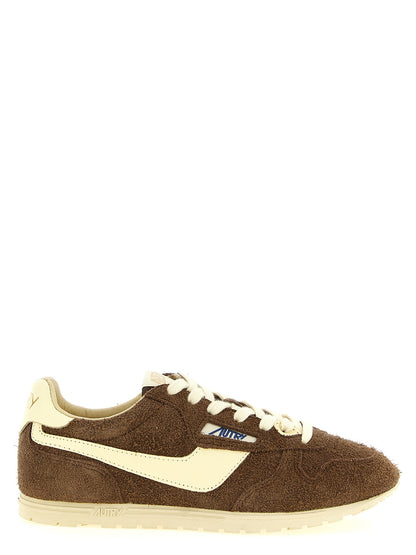 Athletic Sneakers by Autry for women in nylon cotton terry & suede cowhide leather brown & jacquard features an exquisite silhouette, showcasing the premium athletic style of the Women's Athletic Nylon Cotton Terry & Suede Cowhide Leather Sneakers with an exquisite finish.