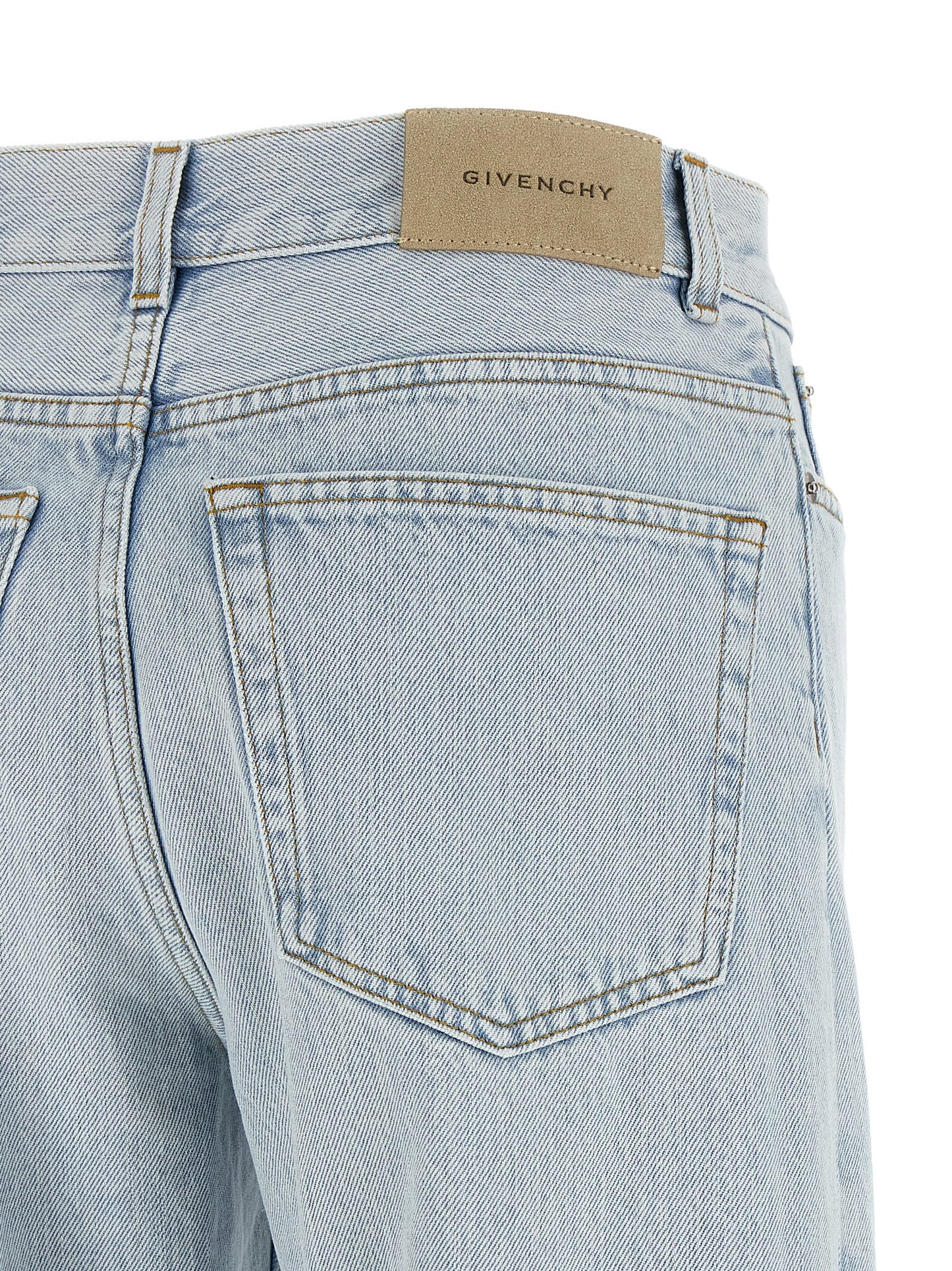Jeans by Givenchy for women in denim cotton & suede leather light-blue & signature features an sophisticated and straight-leg with a precise long, creating a sophisticated and sophisticated silhouette.