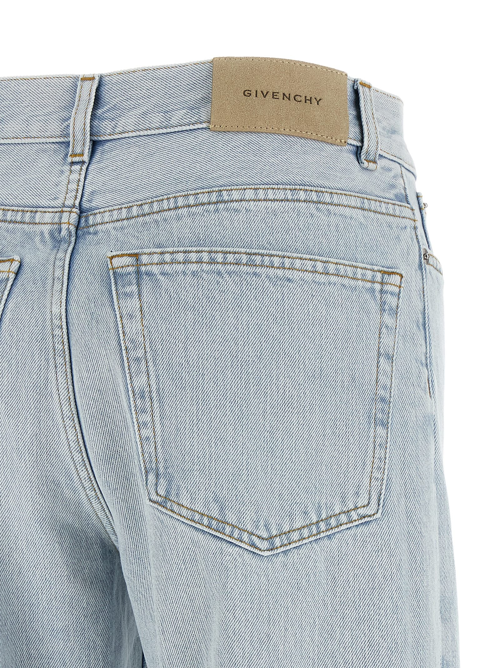 Jeans by Givenchy for women in denim cotton & suede leather light-blue & signature features an sophisticated and straight-leg with a precise long, creating a sophisticated and sophisticated silhouette.