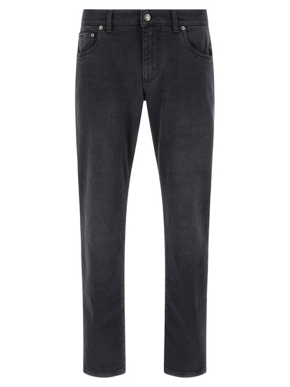 Jeans by Dolce & Gabbana for men in stretch denim cotton black features an sartorial straight-leg & slim and long with a cut for a sartorial finish.