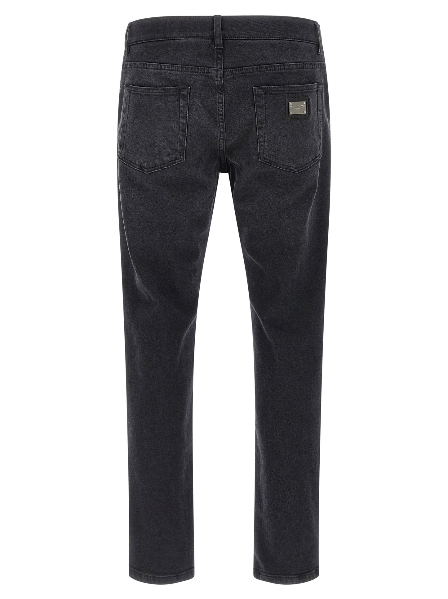 Jeans by Dolce & Gabbana for men in stretch denim cotton black features a polished silhouette with a polished straight-leg & slim, reaching a polished long and finished with a polished .