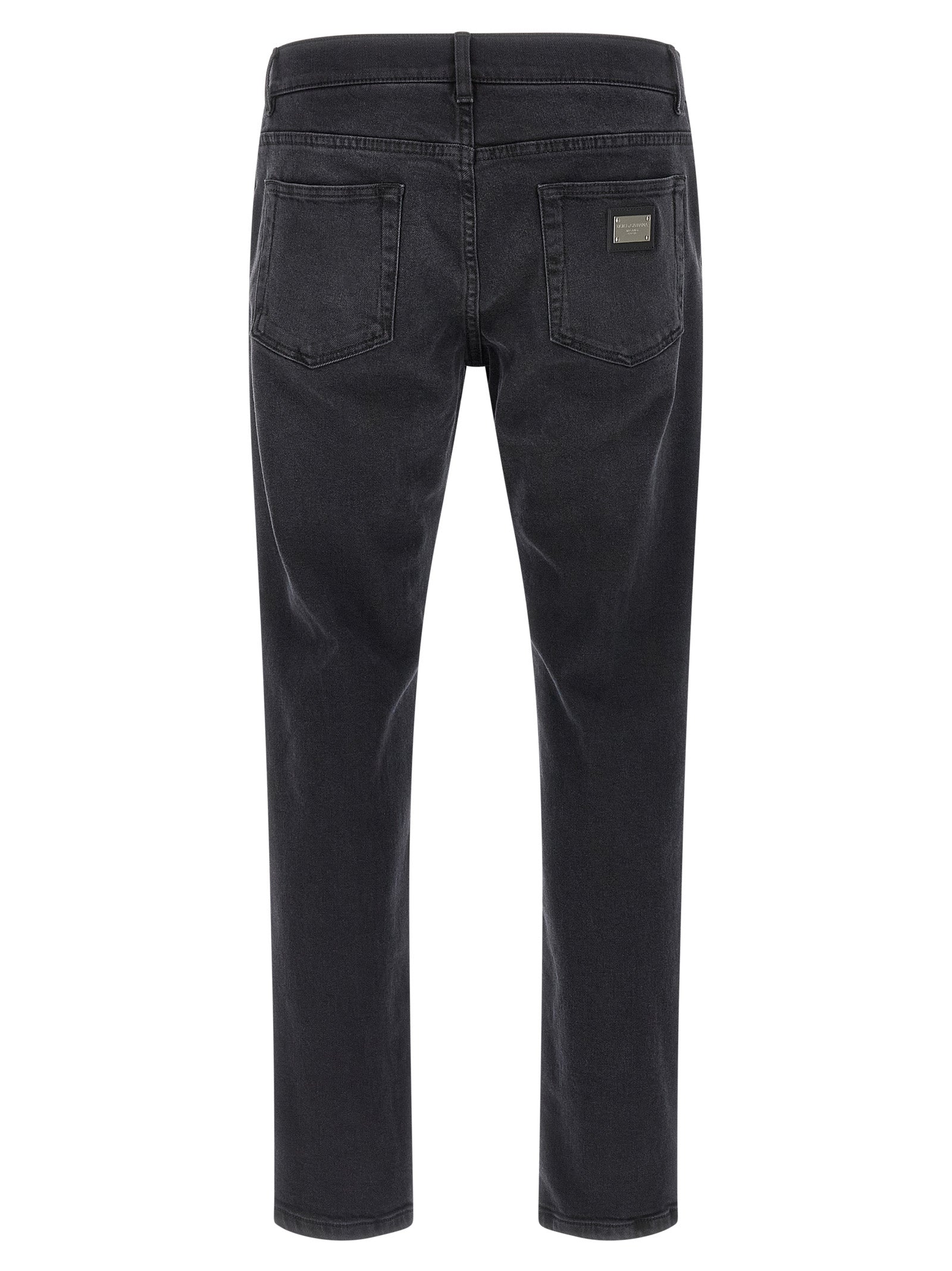 Jeans by Dolce & Gabbana for men in stretch denim cotton black features a polished silhouette with a polished straight-leg & slim, reaching a polished long and finished with a polished .