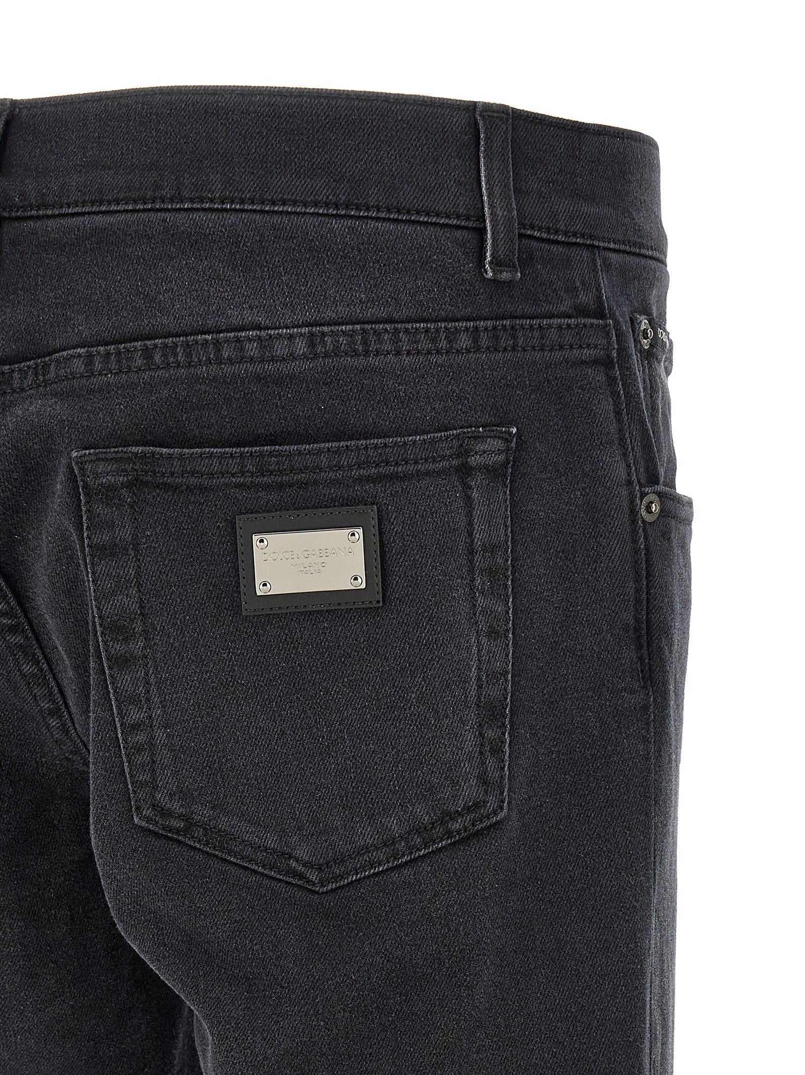 Jeans by Dolce & Gabbana for men in stretch denim cotton black features an sophisticated and straight-leg & slim with a precise long, creating a sophisticated and sophisticated silhouette.
