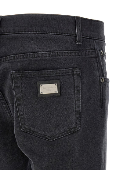 Jeans by Dolce & Gabbana for men in stretch denim cotton black features an sophisticated and straight-leg & slim with a precise long, creating a sophisticated and sophisticated silhouette.