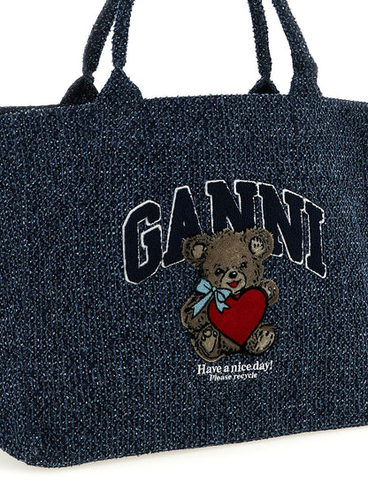 Shopper Tote Bag by Ganni for women in tweed organic cotton denim blue features a distinguished Bear Tweed Organic Cotton Denim Shopper Tote Bag design, complete with a secure , ample , and versatile handle for a distinguished look.
