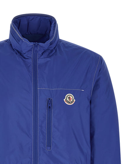 Hooded Windbreaker Jacket by Moncler for men in nylon felt blue & signature presents a resilient silhouette, artfully detailed with a sophisticated hooded neckline and functional pockets, hooded & windproof for a resilient finish.