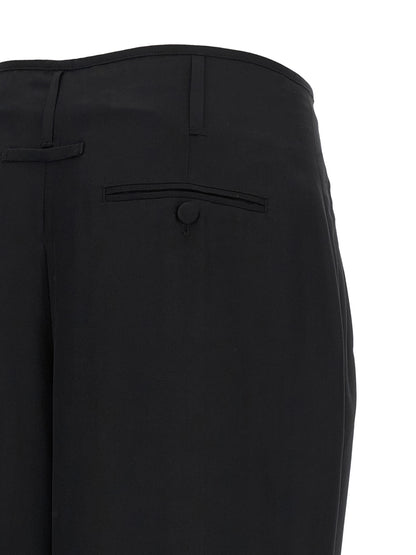 Trousers by Darkpark for women in lyocell & viscose black presents a perennial silhouette, meticulously tailored with a cut, long finish, and an elegant .