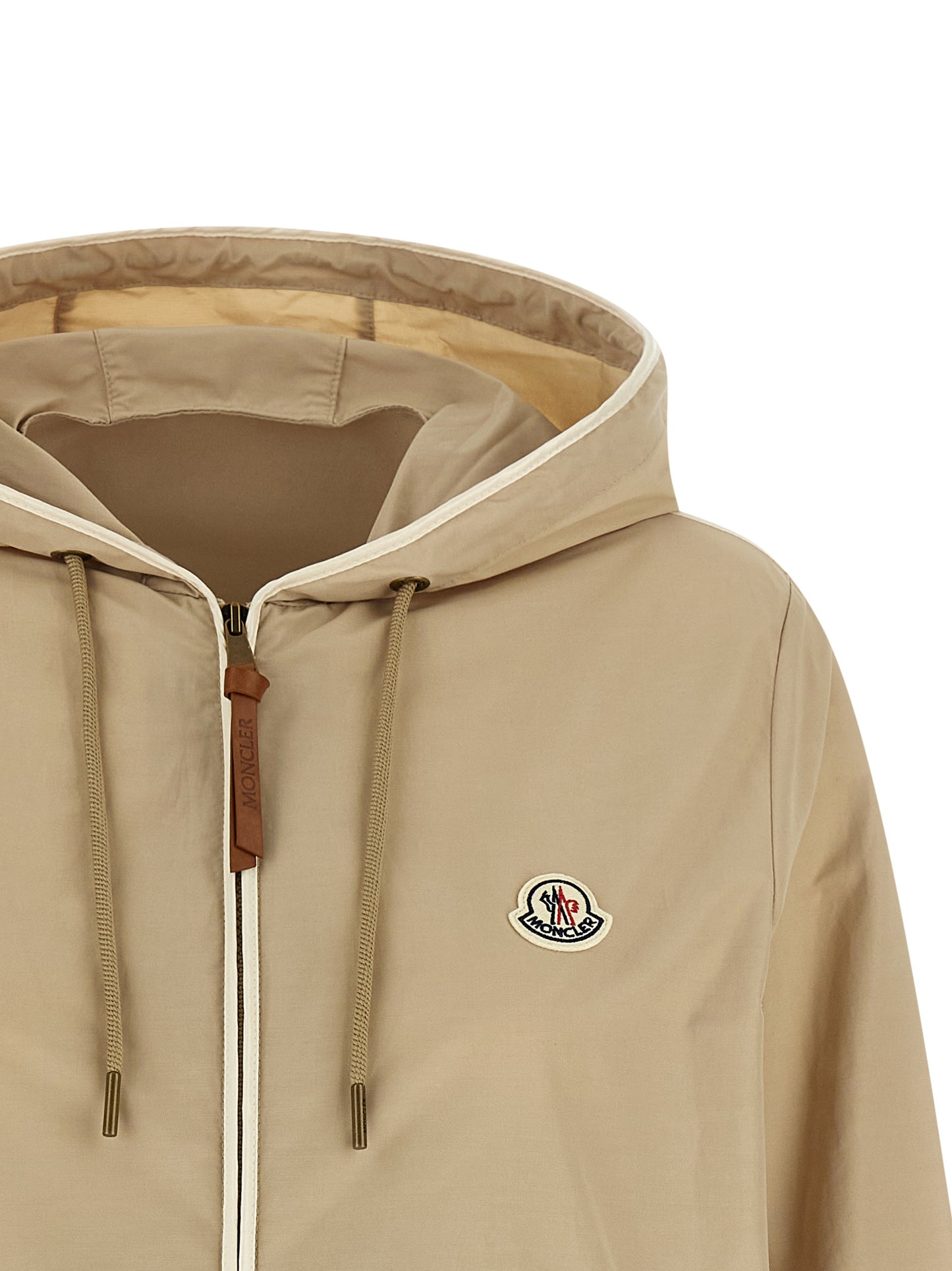 Hooded Windbreaker Jacket by Moncler for women in cotton polyester beige & signature features an perennial silhouette with a refined hooded neckline and perennial pockets, hooded & windproof for a sophisticated weather-resistant look.