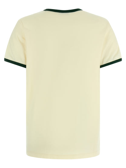 T-Shirt by Moncler for women in cotton beige & print features an edgy silhouette, meticulously detailed with a sophisticated and crew neckline for a truly edgy finish.