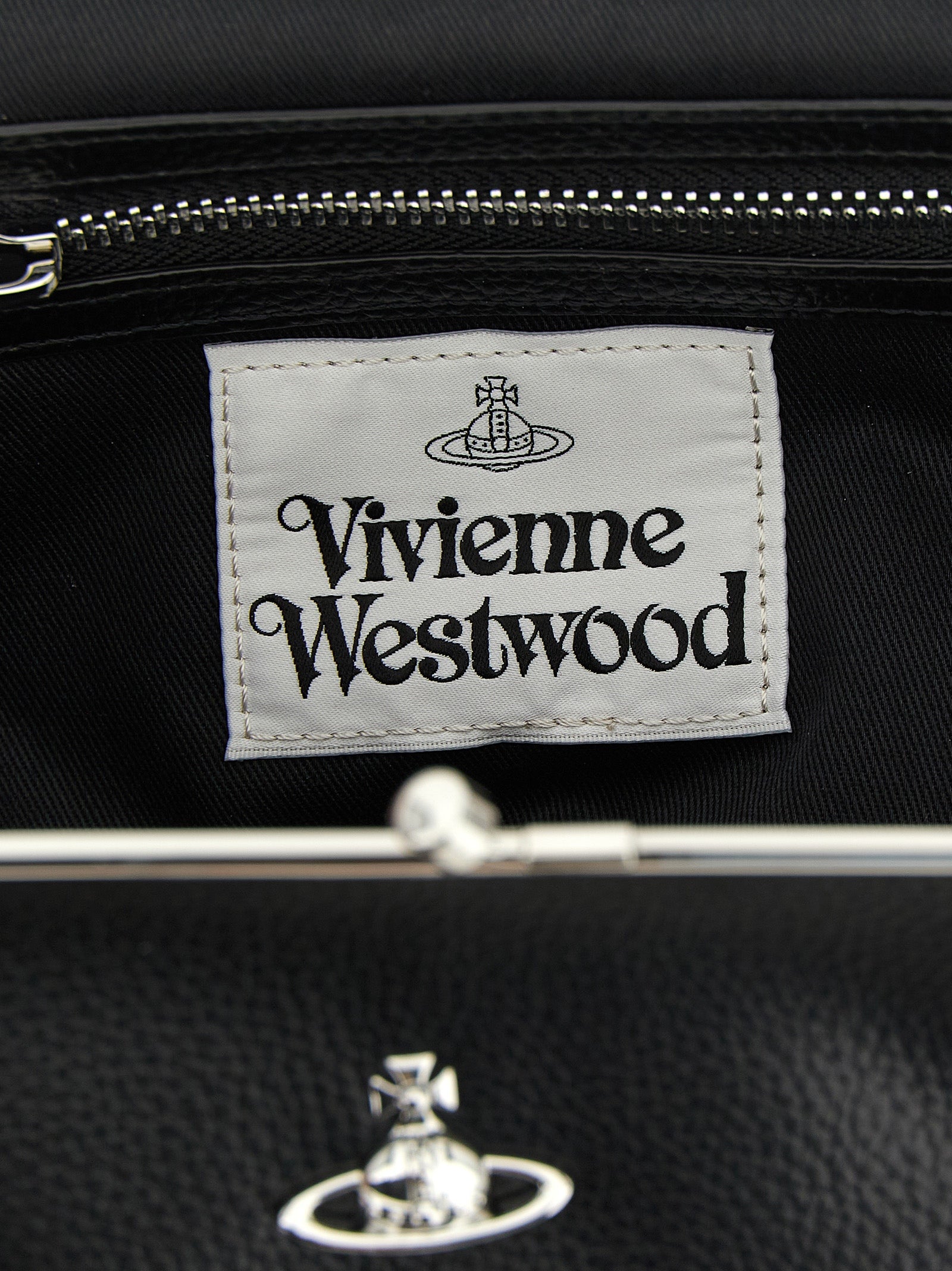 Frame Handbag by Vivienne Westwood for women in pvc cotton polyester black & signature presents a ornamental silhouette, showcasing a secure snap, ample , and versatile shoulder-strap & handle for a ornamental finish.