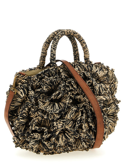 Drawstring Handbag by Ibeliv for women in leather & raffia bicolour, black & white features a signature silhouette, showcasing a secure drawstring and signature with versatile shoulder-strap & handle for a sophisticated look.