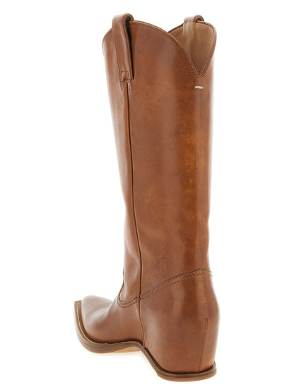 Wedge Chelsea Boots by Maison Margiela for women in bos taurus leather brown & signature features an effortless chic silhouette from the Women's Bos Taurus Leather Wedge Chelsea Boots collection, showcasing a effortless chic wedge and refined pointed toe style for an effortless chic look.