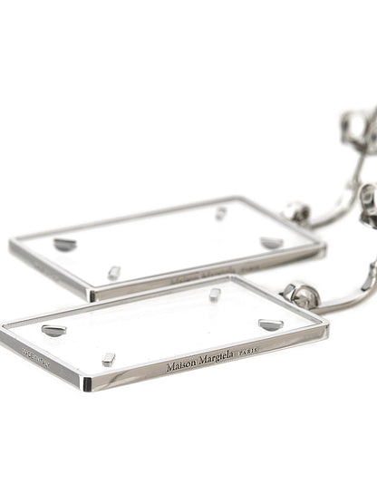 Earrings by Maison Margiela for women in calfskin leather silver showcases a artisanal silhouette, artfully capturing the essence of Four Stitches Women's Silver Brass Earrings with its exquisite .