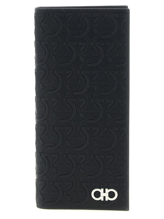 Wallet by Ferragamo for men in calfskin leather black, patterned & signature showcases a distinguished silhouette, artfully capturing the essence of the distinguished Gancini Calfskin Leather Wallet design with functional .