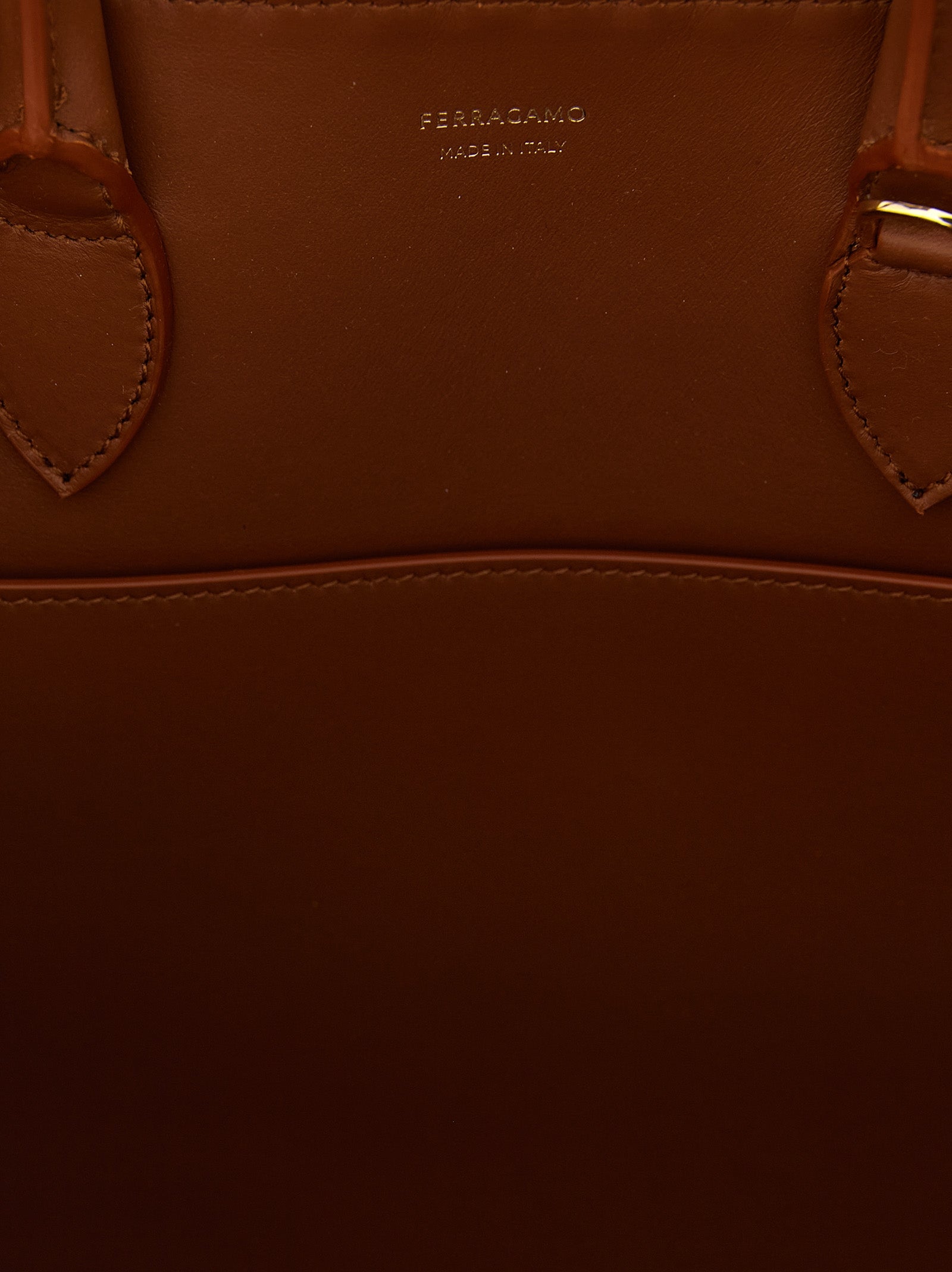 Handbag by Ferragamo for women in calfskin leather brown presents a ornamental silhouette, showcasing a secure , ample , and versatile shoulder-strap, adjustable-strap & handle for a ornamental finish.