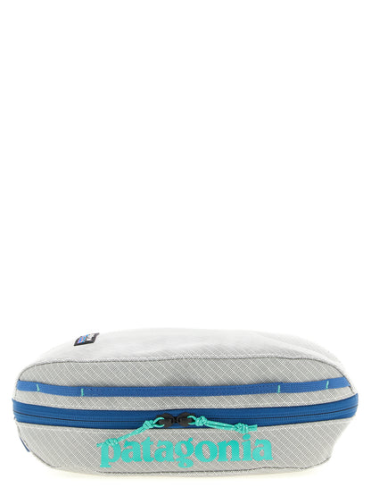Toiletry Bag by PATAGONIA for men in tu & polyester black, gray & print features an chic Black Hole TU & Polyester Toiletry Bag design with a secure zipper, chic , and versatile handle.