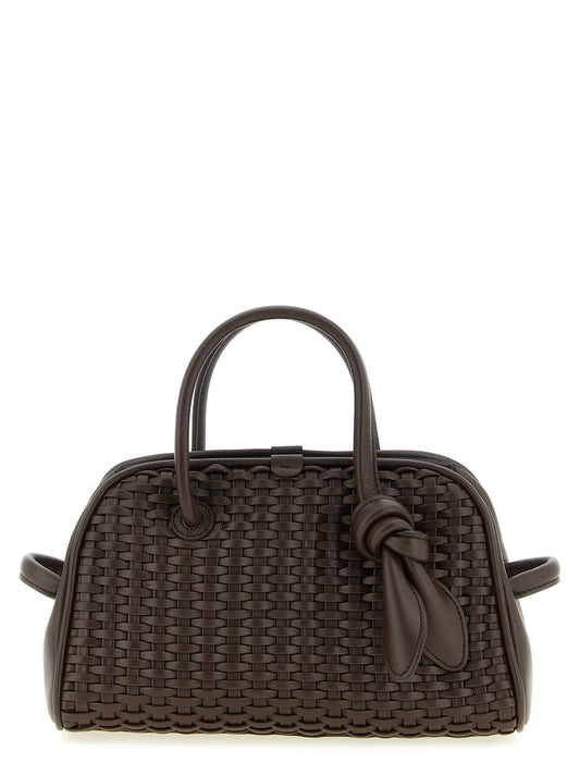 This Bowling Handbag by Jacquemus for women in polyester cotton & suede leather and brown, patterned & chevron presents a sculptural silhouette featuring a secure zipper, ample , and versatile adjustable-strap & handle for a sculptural finish.