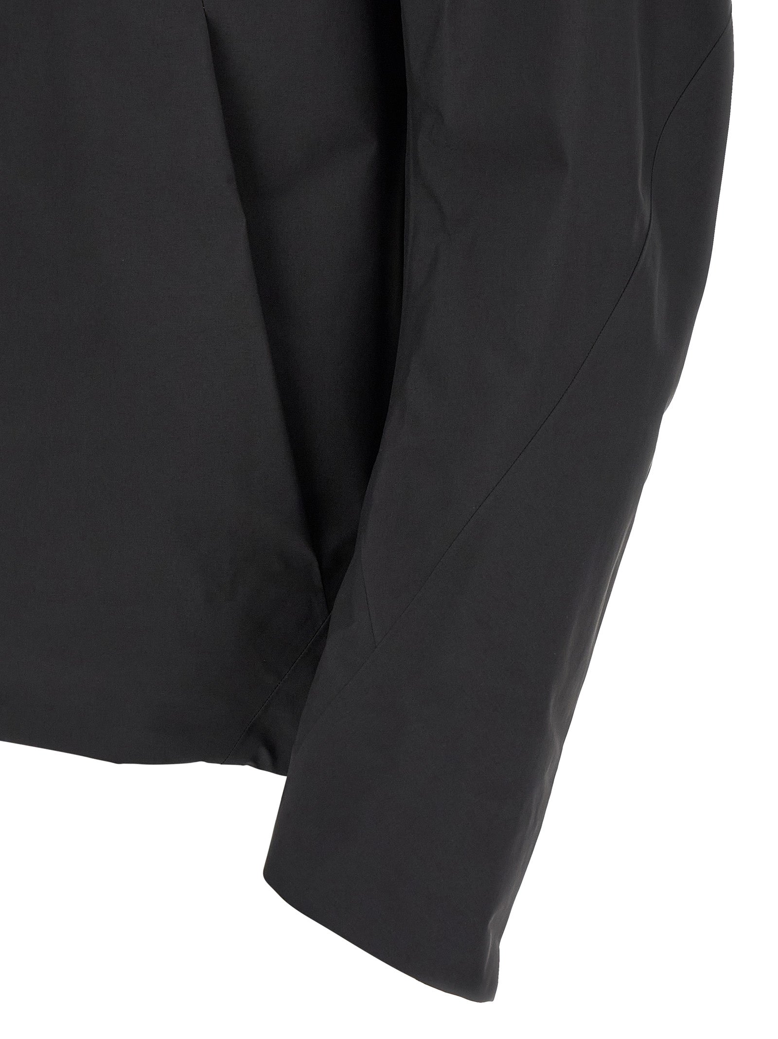 Hooded Windbreaker Jacket by Arc'teryx Veilance for men in nylon black presents a resilient silhouette, artfully detailed with a sophisticated and functional breathable-design, water-resistant, windproof & hooded for a resilient finish.