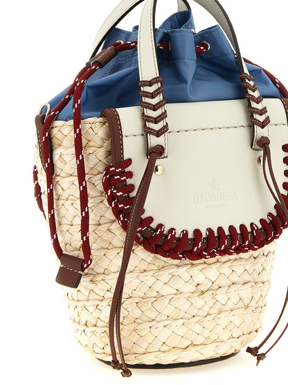 Drawstring Pouch Handbag by CUBA LAB for women in raffia & leather multicolor features an refined silhouette, showcasing a secure drawstring, ample , and versatile shoulder-strap, adjustable-strap & handle for a sophisticated refined aesthetic.