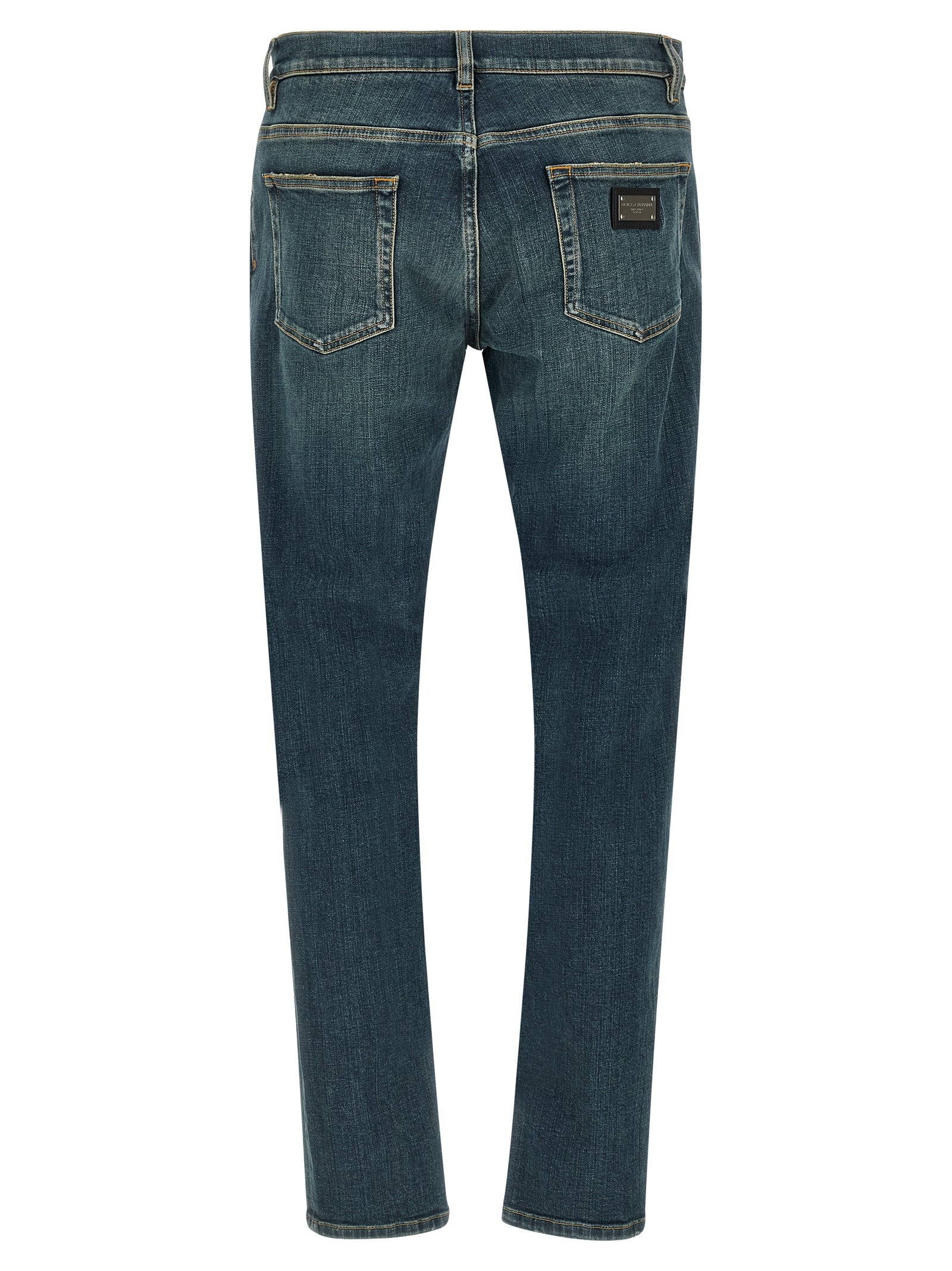Jeans by Dolce & Gabbana for men in stretch denim cotton blue presents a refined pantology silhouette, artfully defined by a refined pantology slim, long, and a sophisticated low rise.