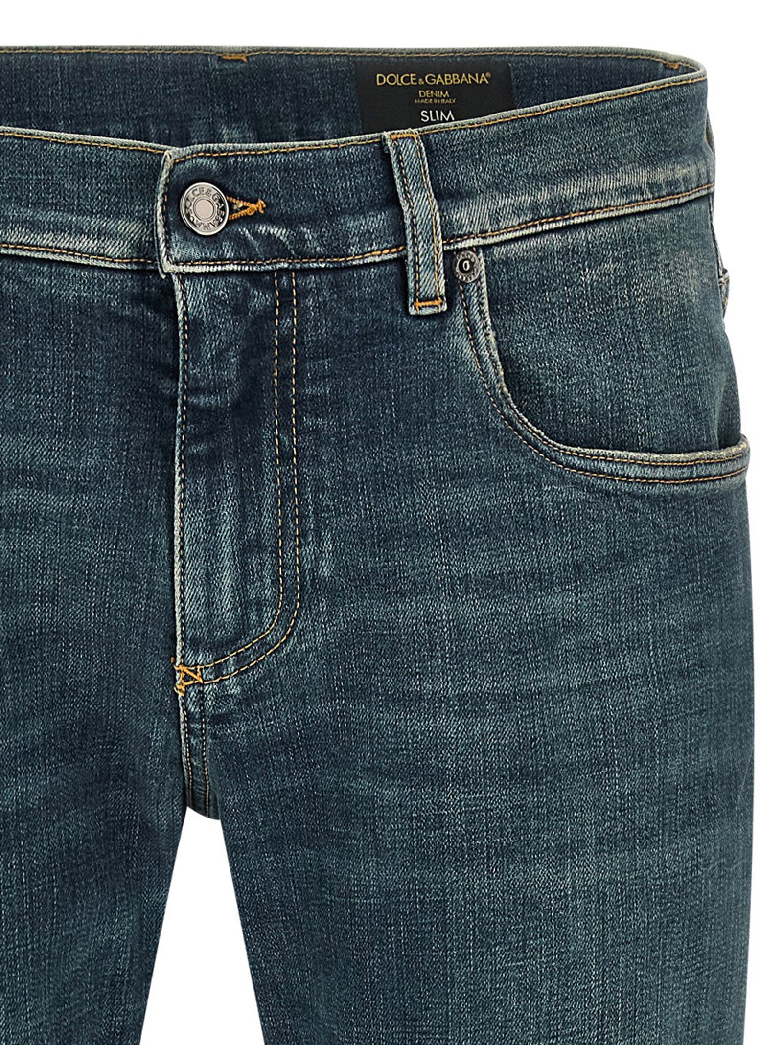 Jeans by Dolce & Gabbana for men in stretch denim cotton blue presents a tailored silhouette, showcasing a tailored slim and long cut with a refined low rise for a truly tailored aesthetic.
