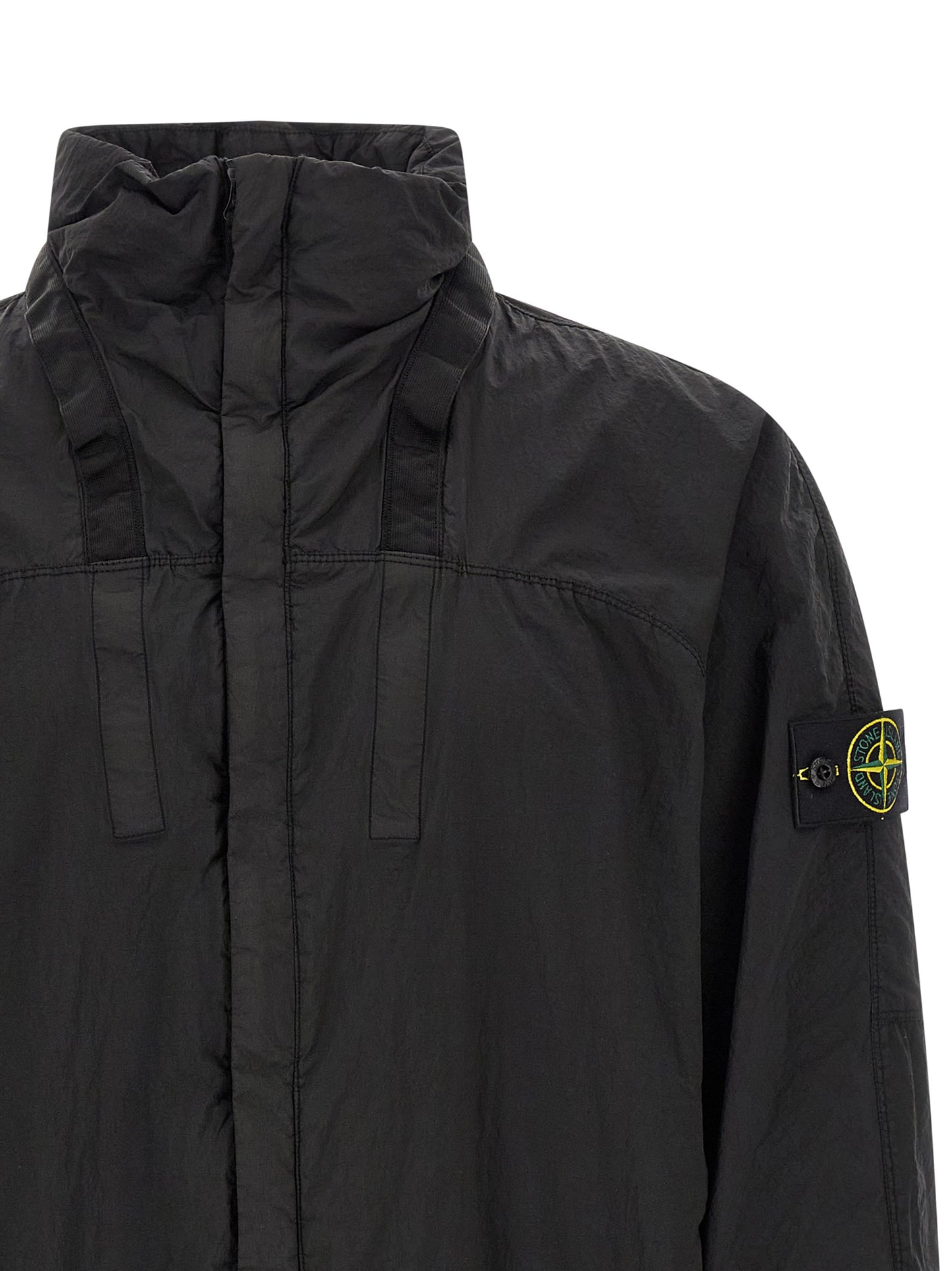 This Hooded Bomber Jacket by Stone Island for men in nylon black exhibits a edgy silhouette, meticulously detailed with functional pockets & hooded and a edgy hooded neckline for a edgy finish.