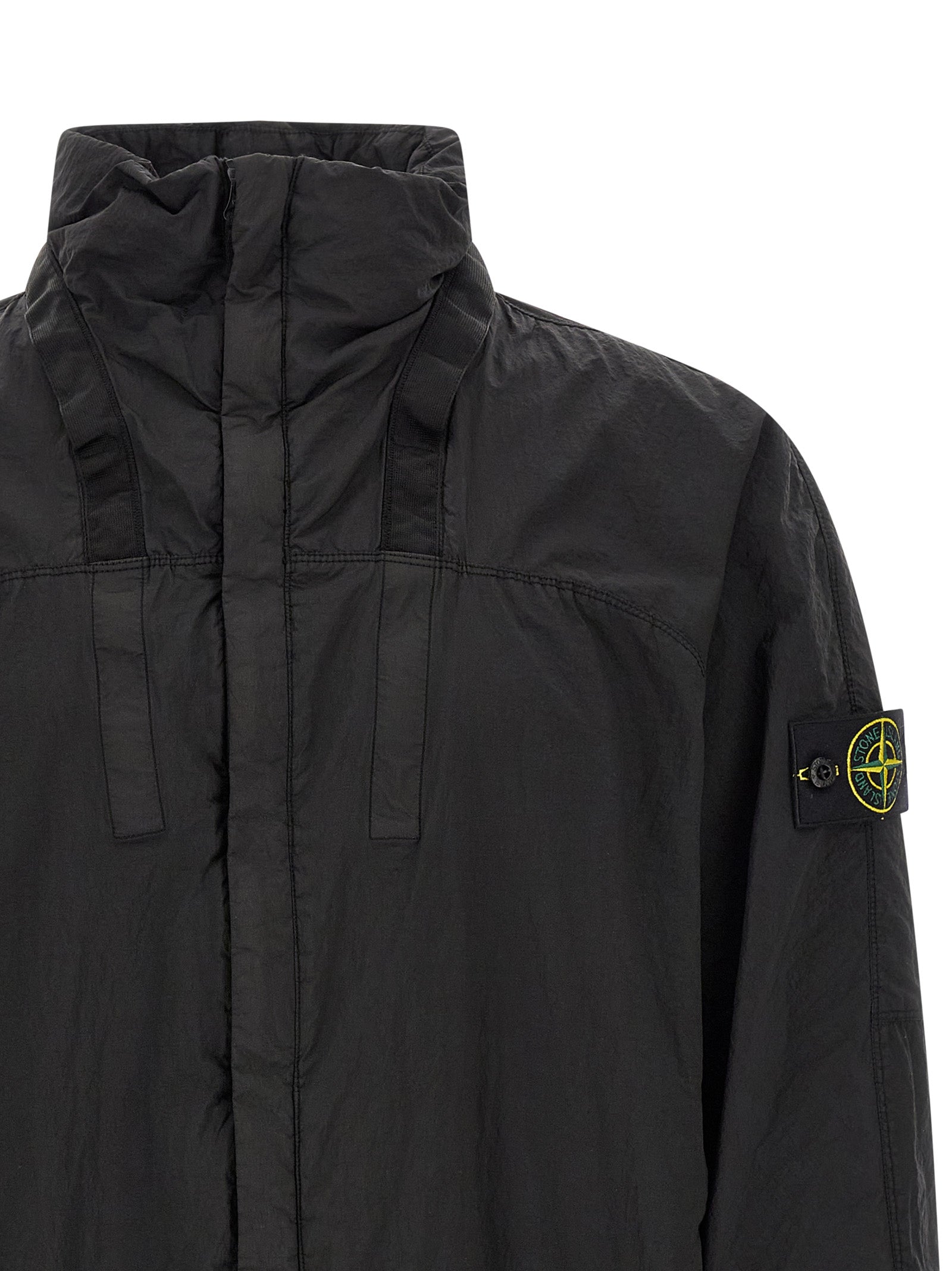 This Hooded Bomber Jacket by Stone Island for men in nylon black exhibits a edgy silhouette, meticulously detailed with functional pockets & hooded and a edgy hooded neckline for a edgy finish.