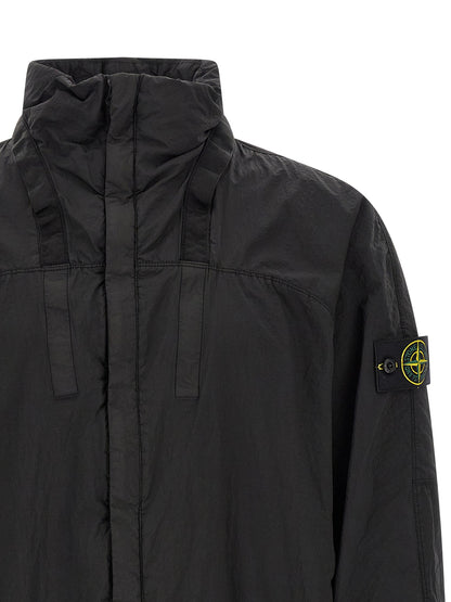 This Hooded Bomber Jacket by Stone Island for men in nylon black exhibits a edgy silhouette, meticulously detailed with functional pockets & hooded and a edgy hooded neckline for a edgy finish.