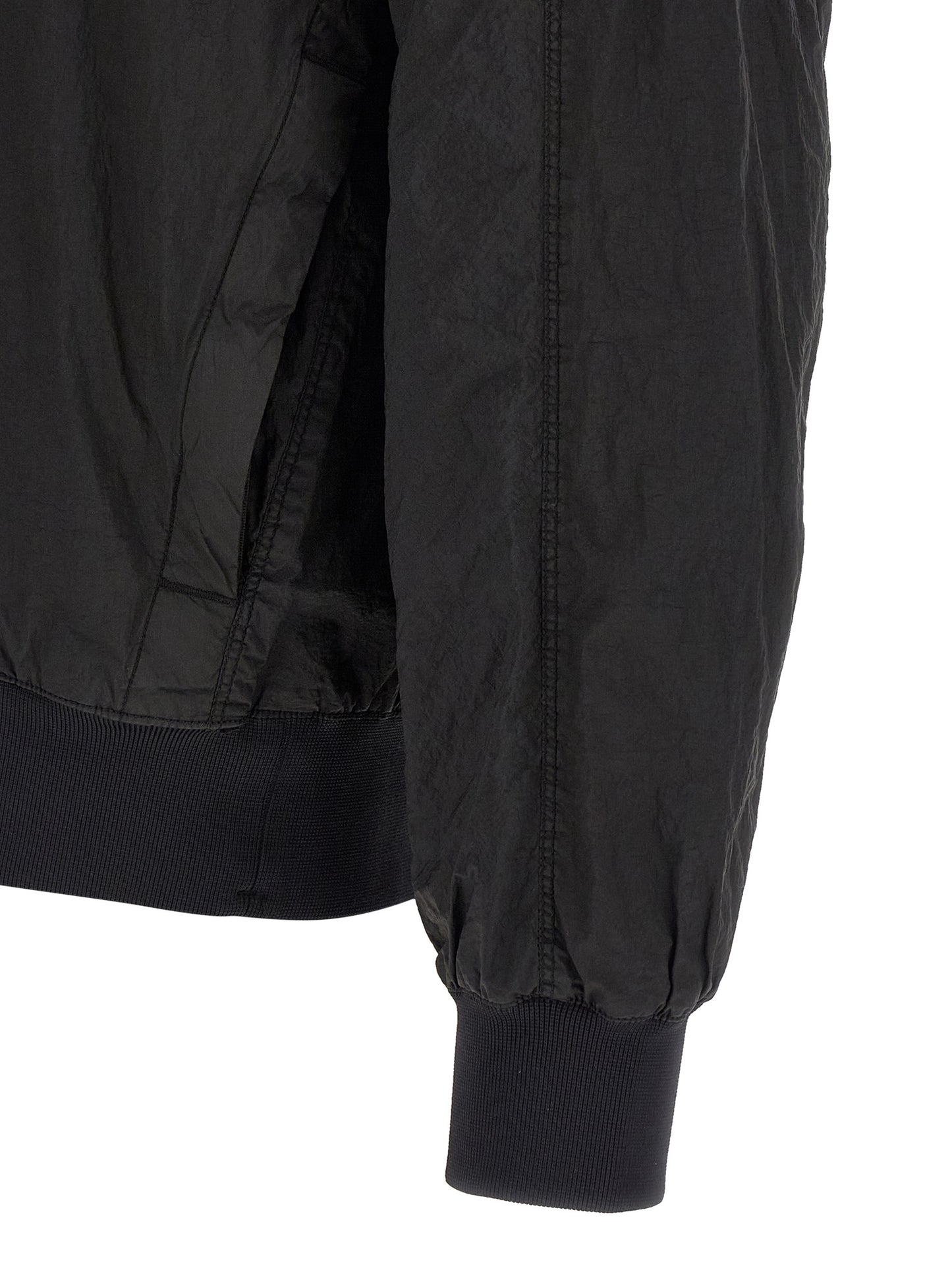 Hooded Bomber Jacket by Stone Island for men in nylon black features a dramatic silhouette, showcasing a sophisticated and distinctive pockets & hooded for a dramatic aesthetic.