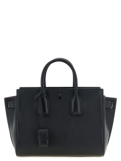 East West Handbag by Saint Laurent for women in viscose goat leather & fur black features a signature silhouette, showcasing a secure and signature with versatile adjustable-strap & handle for a sophisticated look.
